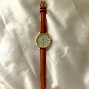 Geneva minimalistic watch with tan wristwatch band